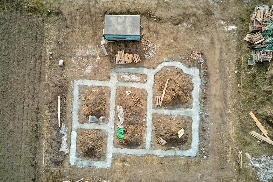 Large scale fill dirt delivery project completed in Waynesville NC showing dump truck delivering premium quality fill dirt
